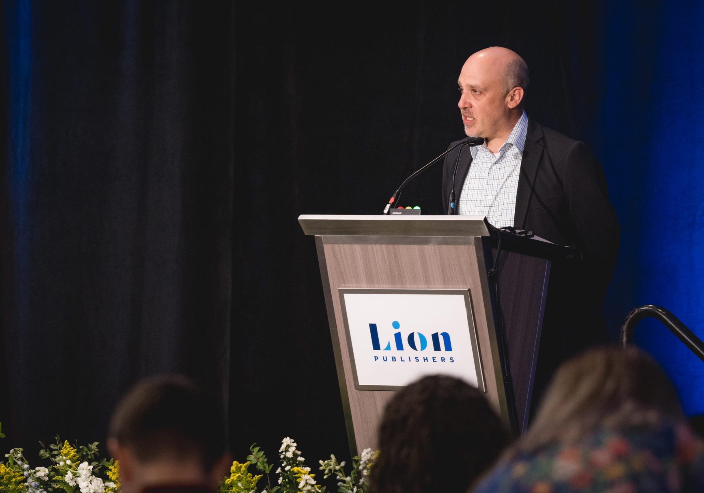 LION's executive director, Chris Krewson, welcomes attendees to the 2024 Independent News Sustainability Summit. Photo by Fig Media.